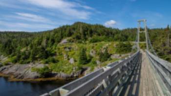 Suspension bridge to the former village of La Manche | Sherry Ott