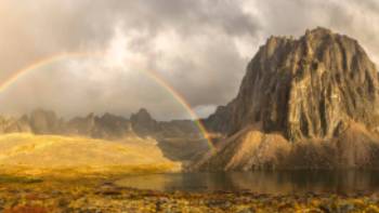A colourful rainbow near Talus Lake in the Yukon | Robert Postma Photography