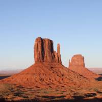 The Monument Valley buttes, on the Utah - Arizona border, lights up at sunset | Brad Atwal